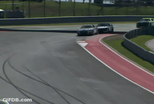 Race Car Driving Down Track GIF