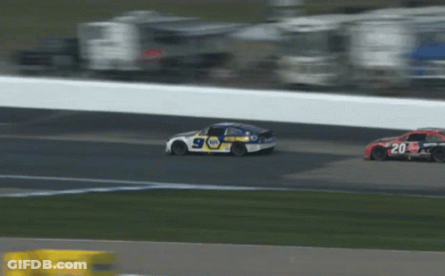 Race Car Driving Down Track With Cars Behind GIF