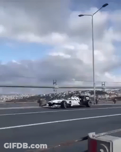Race Car Driving On Highway GIF