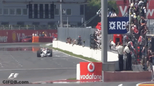 Race Car Going Down Track With Vodafone Sign GIF