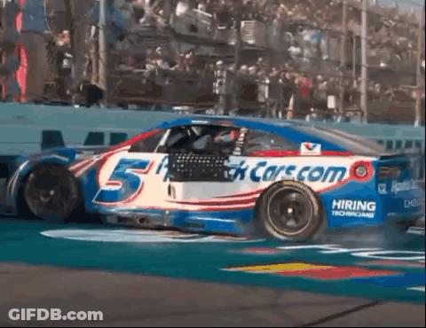 Race Car Number 5 Driving Down Track GIF