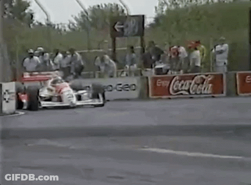 Race Car On Track With Coca Cola Sign GIF