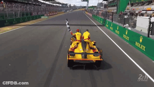 Race Car On Track With Rolex Ads GIF