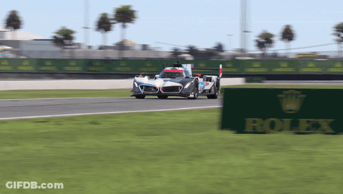 Race Car On Track With Rolex Sign GIF