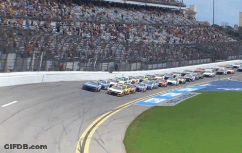 Race Cars Lined Up On Track Saying A GIF