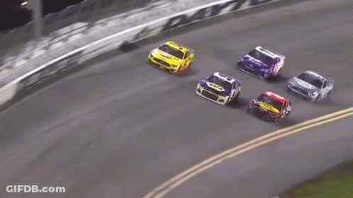 Race Cars Racing Down Track GIF