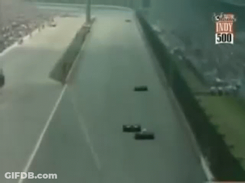 Race Cars Racing On Indy 500 Track GIF