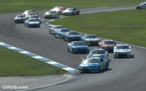 Race Cars Racing On Track With Number 5 GIF