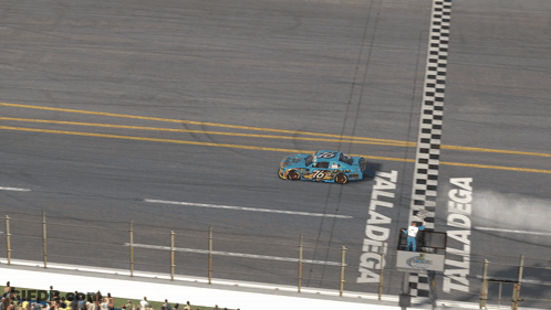 Race Track With Geico Sign GIF