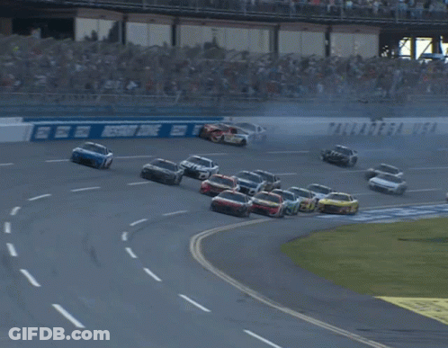 Race Track With Geico Sign GIF