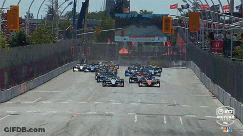 Racing Cars Going Down Track GIF