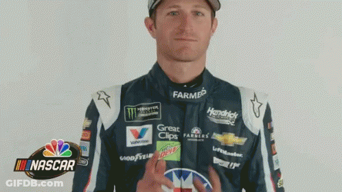 Racing Suit Man Flipping Bird In Front Of NASCAR Logo GIF