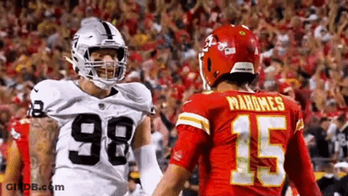 Raiders And Chiefs Football Players Standing GIF