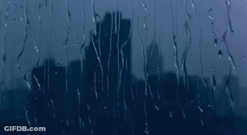 Rain Drops On Window With City Skyline GIF