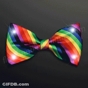 Rainbow Bow Tie Lit Up On Dark Background GIF