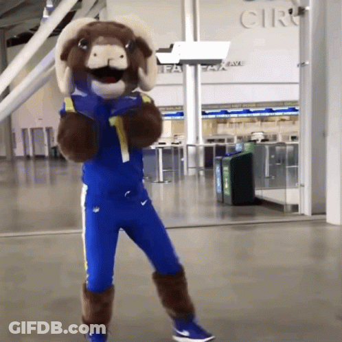 Ram Mascot Standing Before Cir GIF