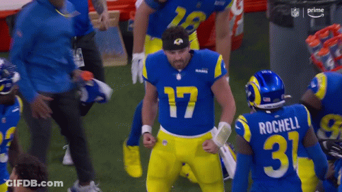 Rams Players Standing On Field GIF