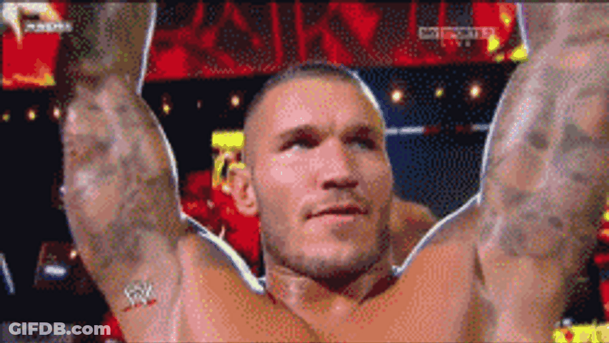 Randy Orton Arms Up Biting Lips GIF