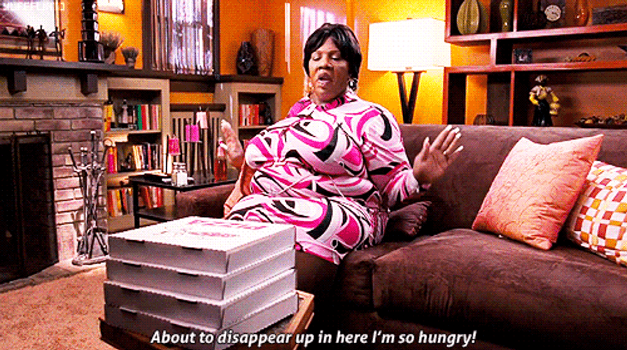 Rasputia Uneasy Sitting On Couch GIF