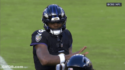 Ravens Football Player Wearing Helmet And Jersey GIF