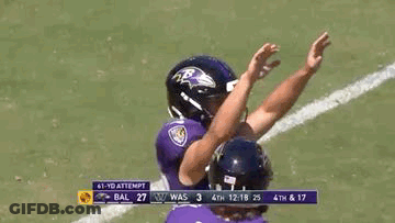 Ravens Football Players High Fiving On Field GIF
