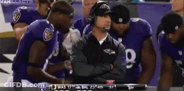 Ravens Players Huddle Around Coach GIF