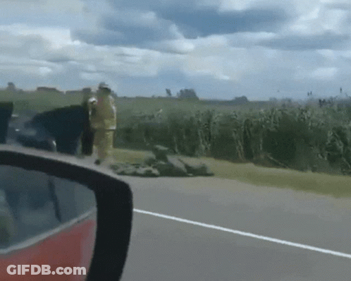 Rear View Mirror Fireman On Road GIF
