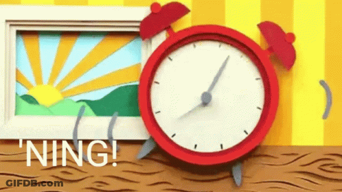 Red Alarm Clock Next To Sunrise Photo GIF