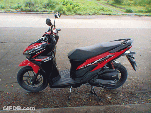 Red And Black Honda Scooter Parked GIF