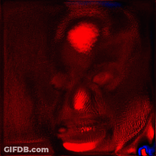 Red And Black Painting Of A Face GIF