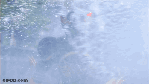 Red And Green Mask Superhero In Rain GIF