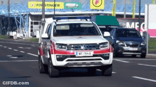 Red And White Car With License Plate WE 164 A GIF