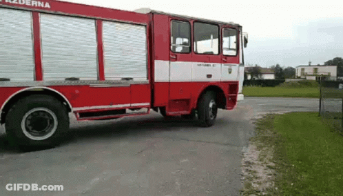 Red And White Fire Truck Parked GIF
