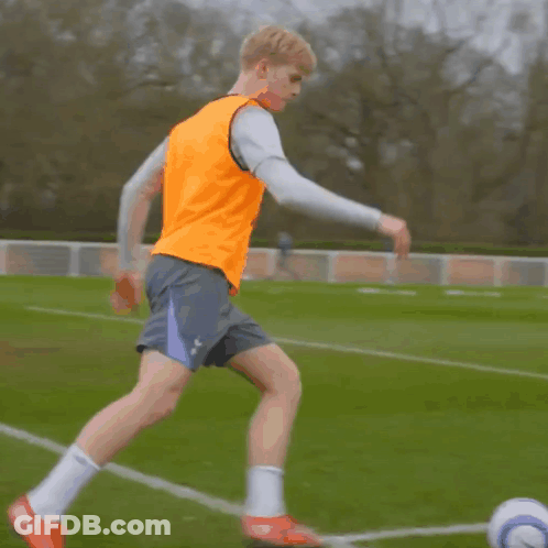 Red And White Jersey Girl Kicks Soccer Ball GIF