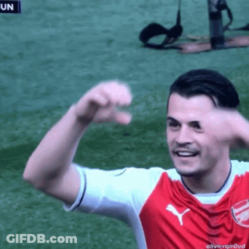 Red And White Puma Jersey Soccer Player Smiling GIF