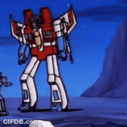Red And White Robot With Wings Standing In Field GIF