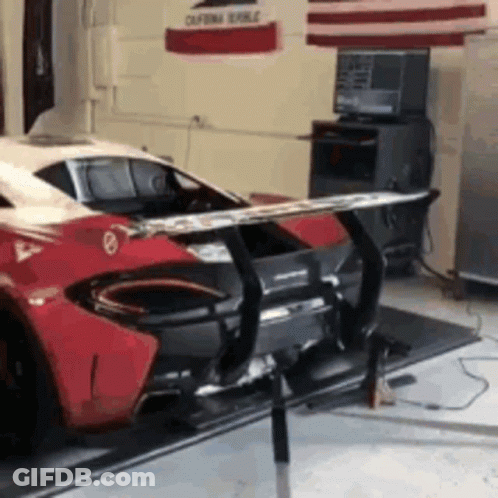 Red And White Sports Car In Garage GIF