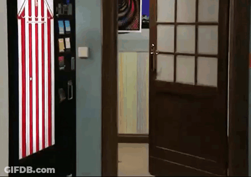 Red And White Striped Door Open To Vending Machine Room GIF