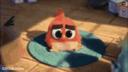 Red Angry Bird Sitting On Blue Rug GIF