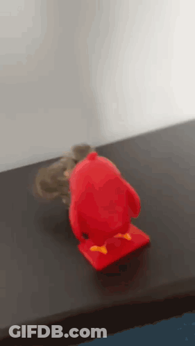 Red Angry Bird Toy Next To Mouse GIF