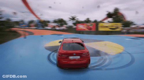 Red BMW Driving On Blue Track GIF
