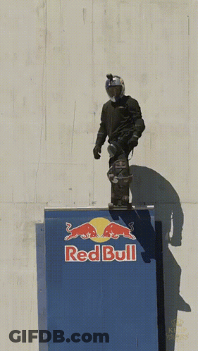 Red Bull Ad On Building In City GIF