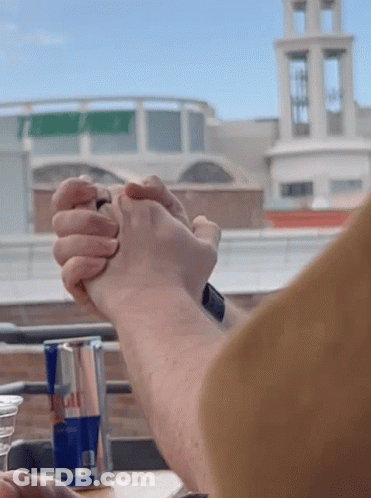 Red Bull Can With Two People Holding Hands GIF