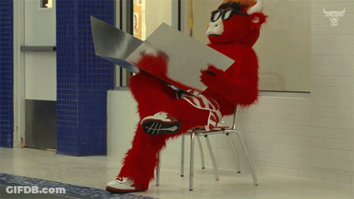 Red Bull Mascot Reading A Book GIF