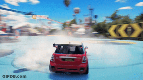 Red Car Driving Around Track With Hot Wheels Autoshow Sign GIF