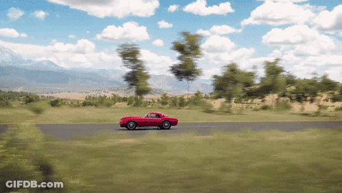 Red Car Driving Down Road With Trees GIF