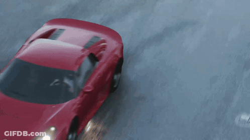 Red Car Driving Down Wet Road GIF