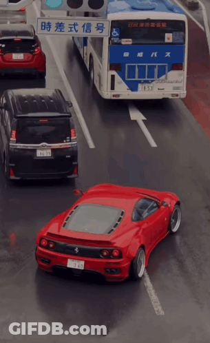 Red Car Driving Next To Bus GIF