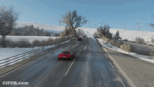 Red Car Driving On Snowy Road In Video Game GIF
