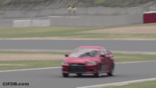 Red Car Driving On Track With Grass GIF